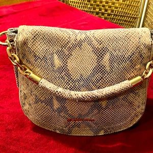 Michael Kors snake skin purse with a zippered pouch.. Gently used
